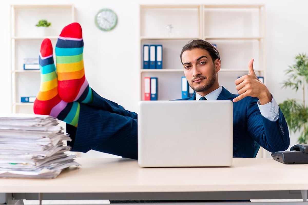 A businessman shows his support for the LGBTQ+ community while at the office.