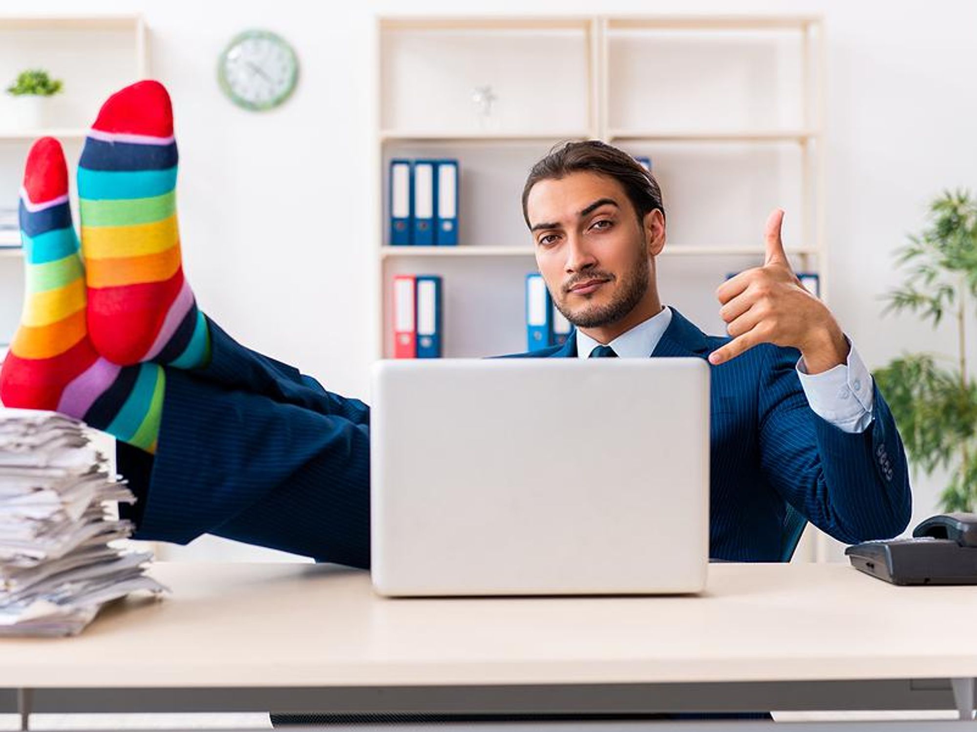 A businessman shows his support for the LGBTQ+ community while at the office.