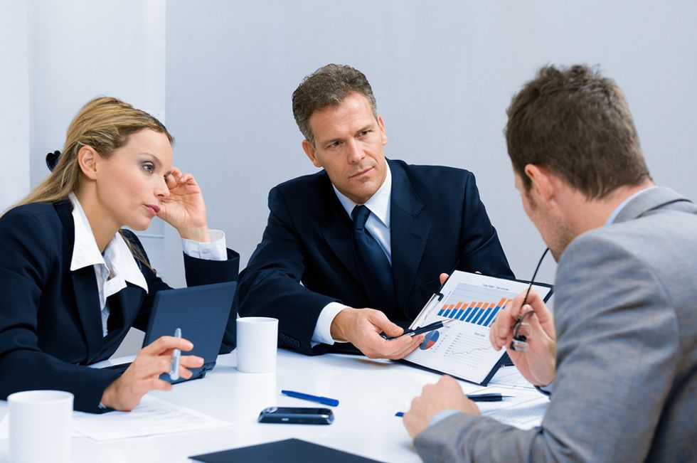 A company's management team discusses strategy.