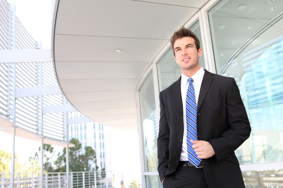 A confident job seekers walks away confidently after getting a job interview early in the job search process.
