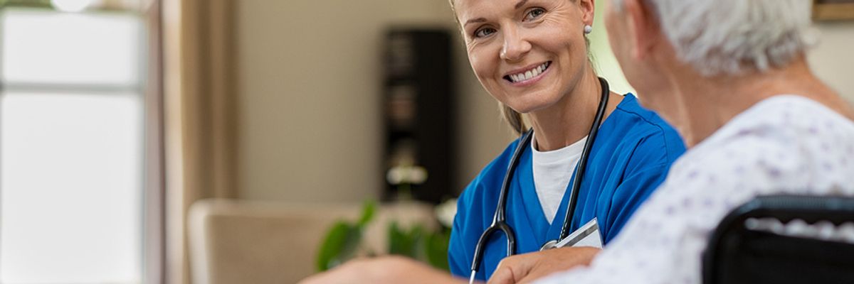 A doctor speaks to a patient. Doctor is considered a "recession-proof" career