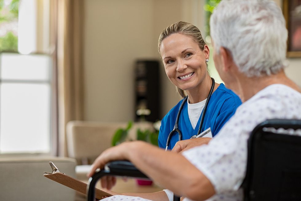 A doctor speaks to a patient. Doctor is considered a "recession-proof" career