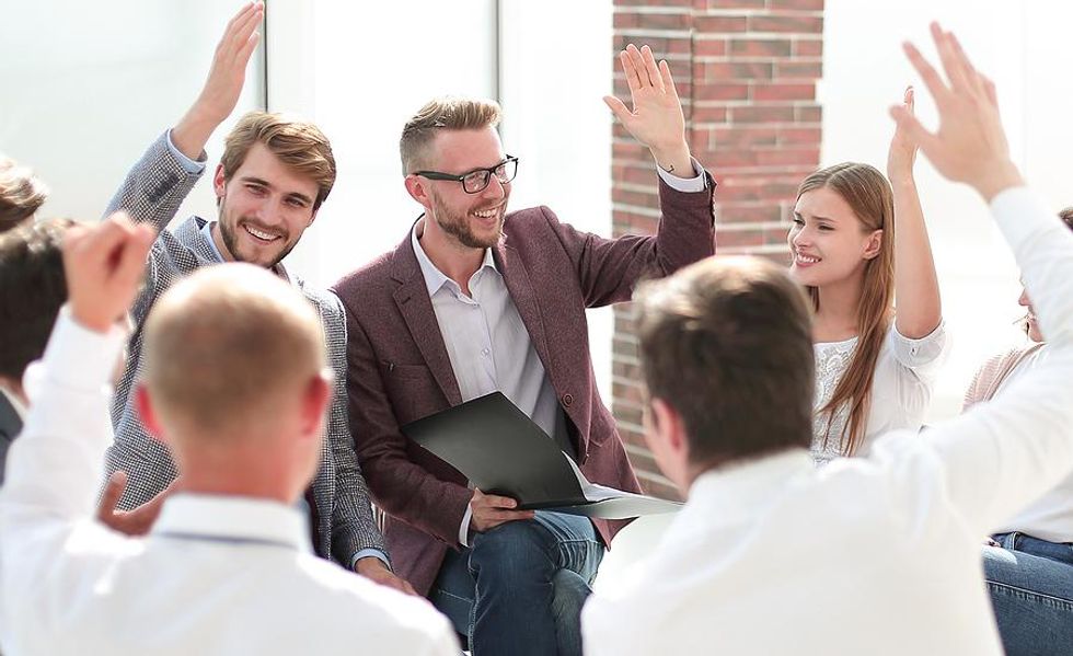 A group of professionals take part in an activity during a networking event.