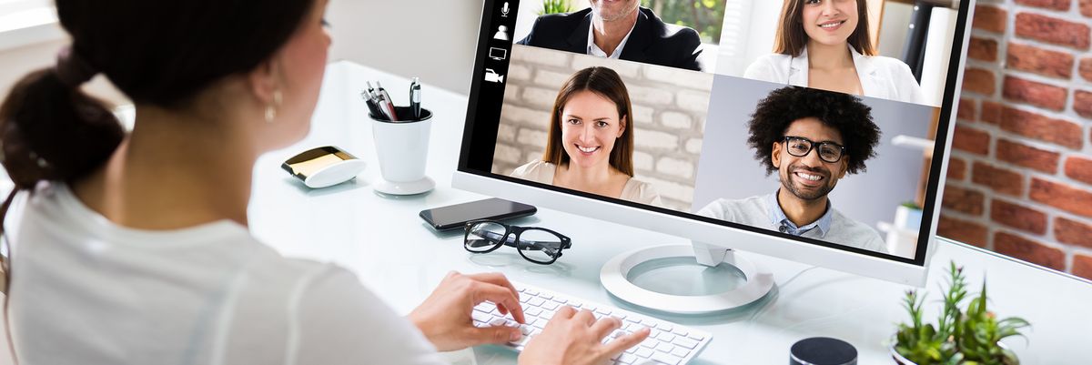 A job candidate discusses her qualifications on a video call.