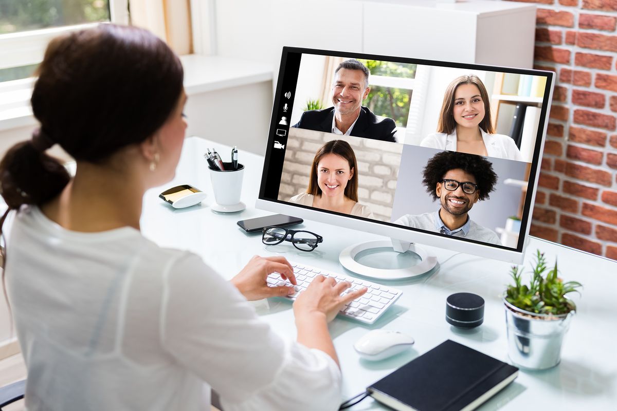 A job candidate discusses her qualifications on a video call.