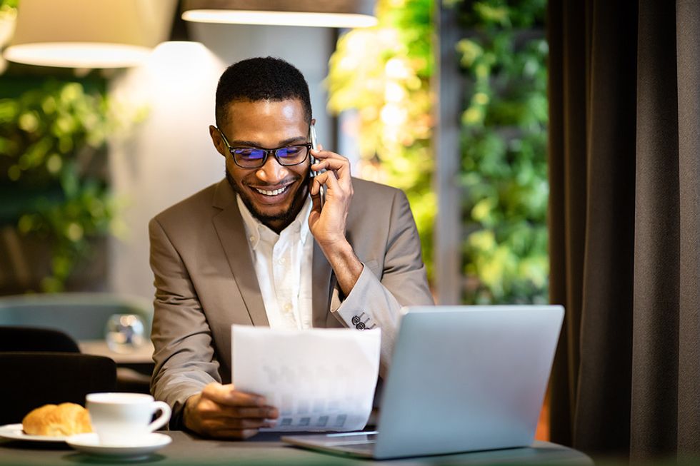 A job seeker has an informational interview on the phone.