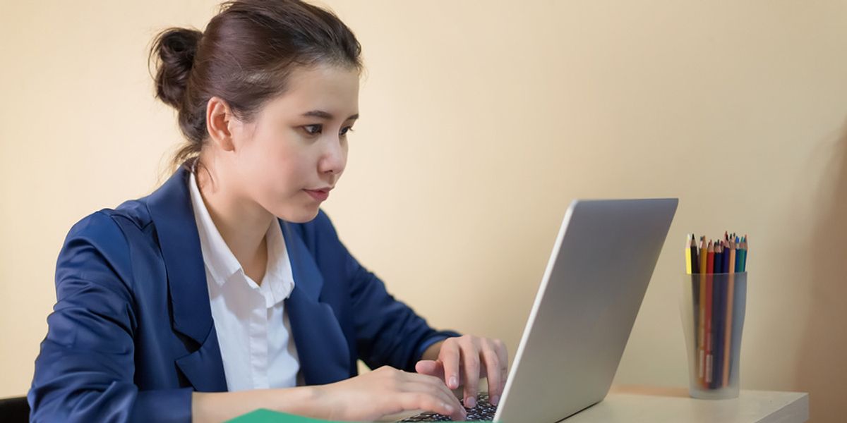 A job seeker researches the companies she is applying to work for.