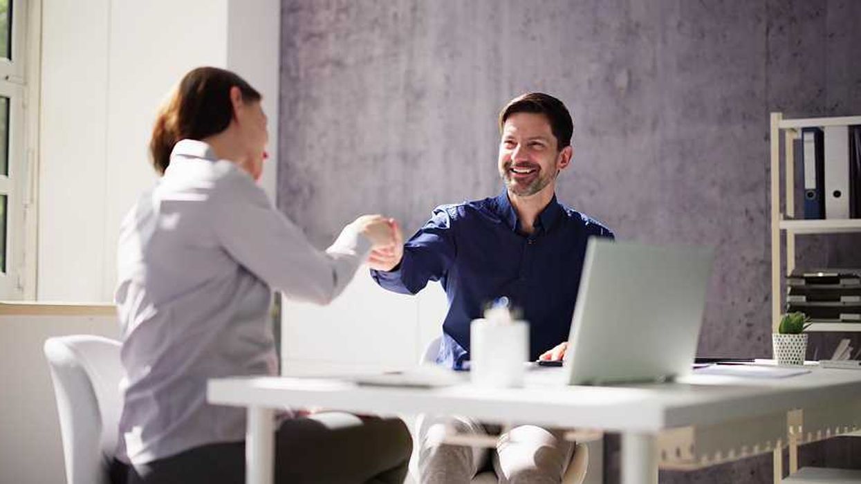A leader engaging in authentic conversation with a colleague, symbolizing human connection over perfection