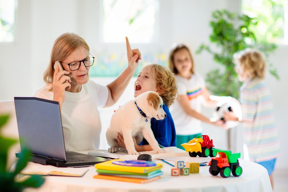 A mother attempts to work from home, while taking care of her kids.