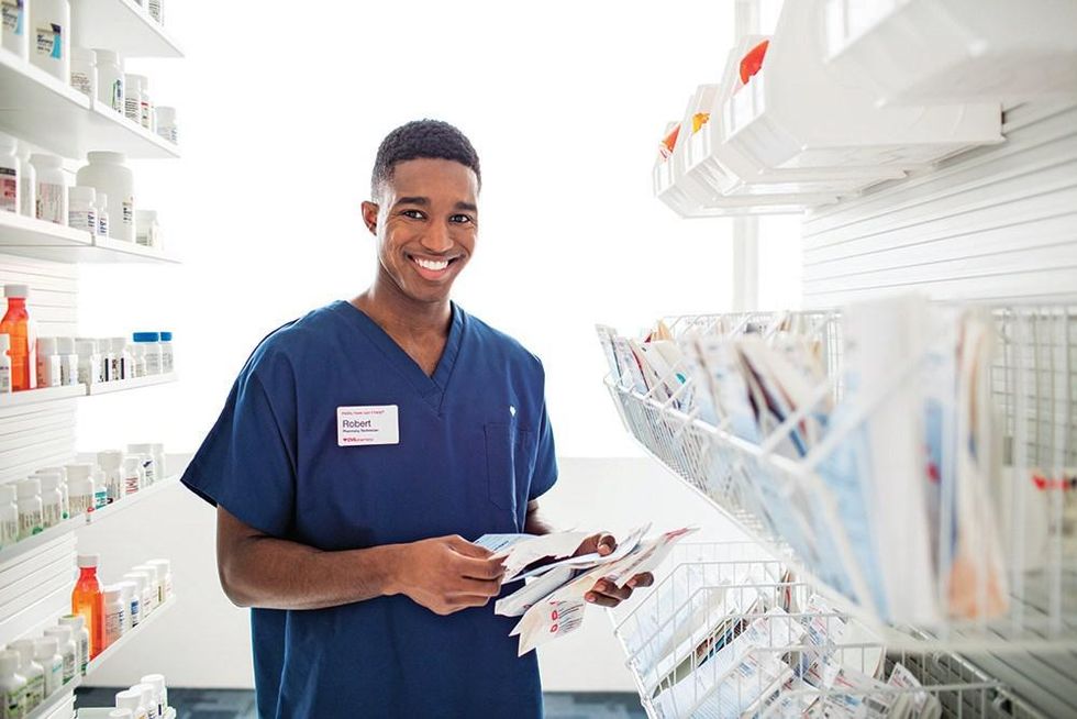 A pharmacy technician sorts prescriptions.