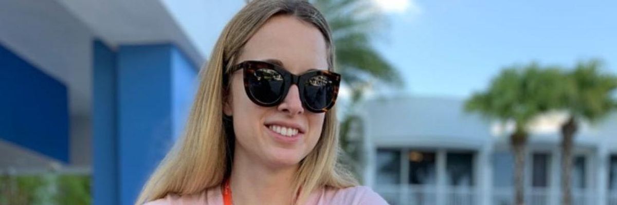 A remote worker at Zapier works poolside.