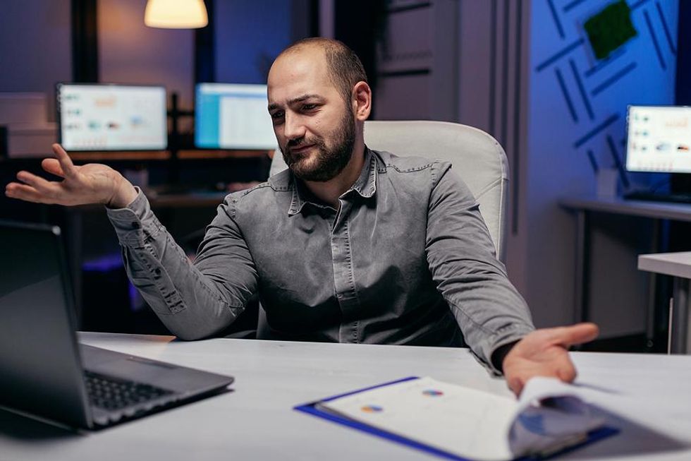 A remote worker shrugs off a suggestion to take a vacation.