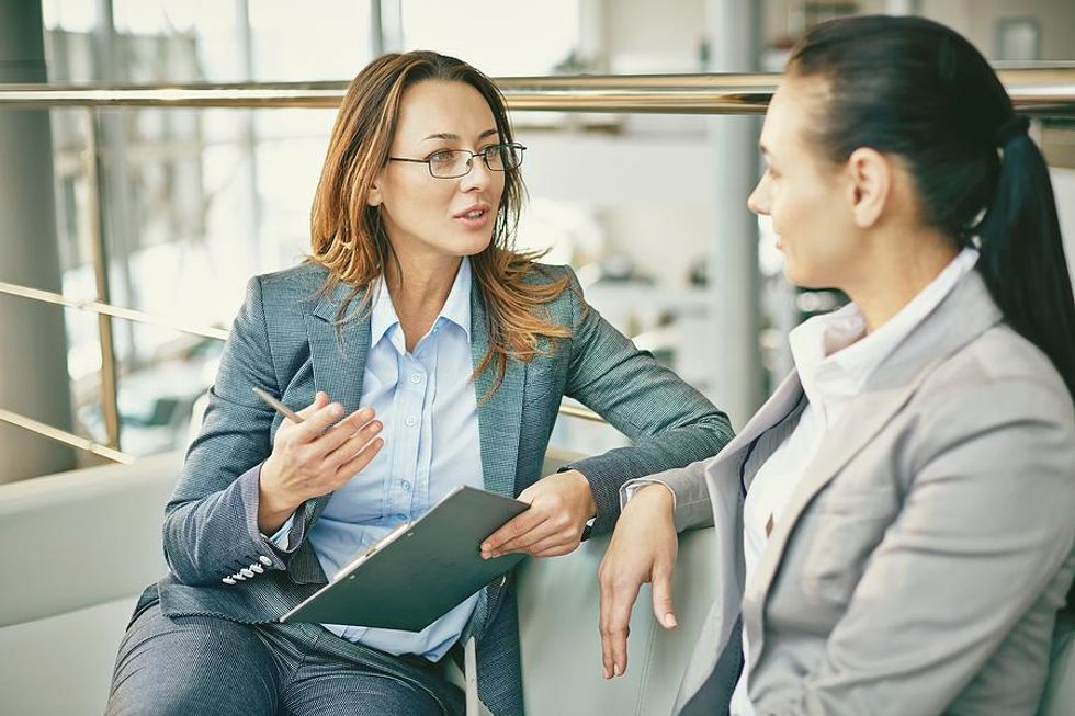 A salesperson leads a conversation with a potential customer