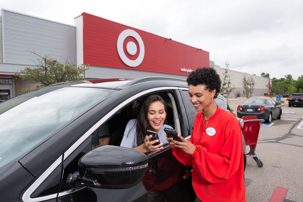 A Target employee helps a customer at the Drive-Up.