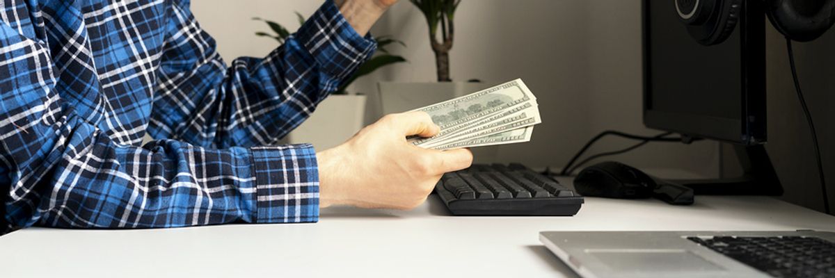 A young professional runs is side hustle business from home.