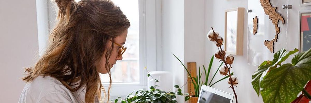 A young professional works a freelance job from her home office.