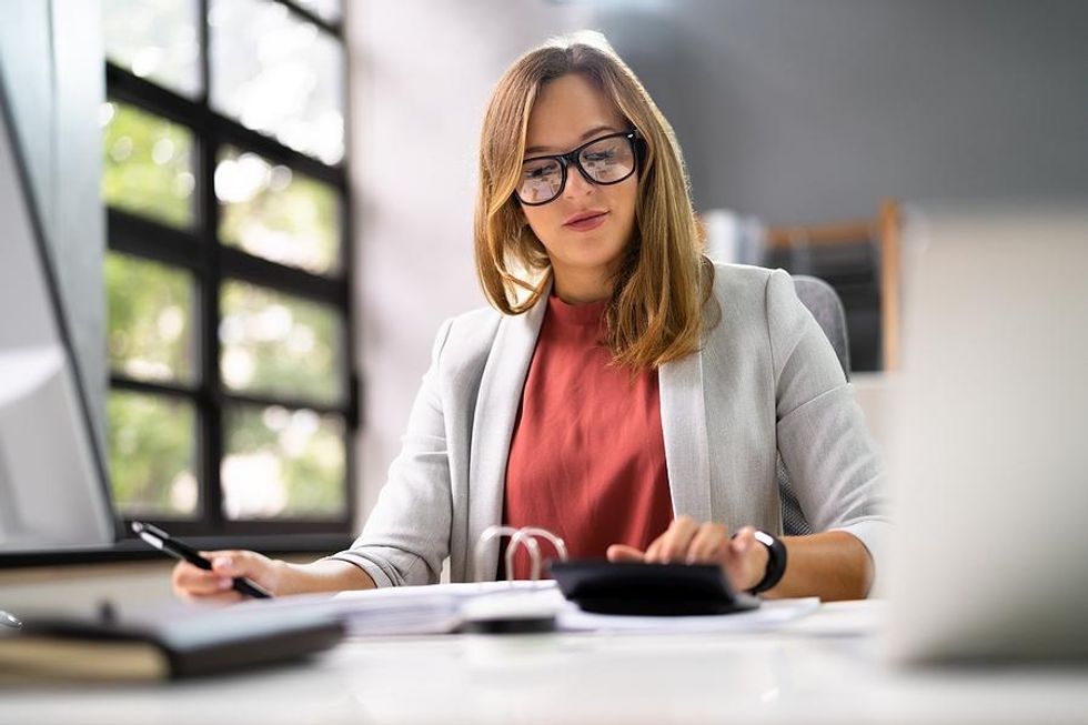 Accountant calculates finances at work