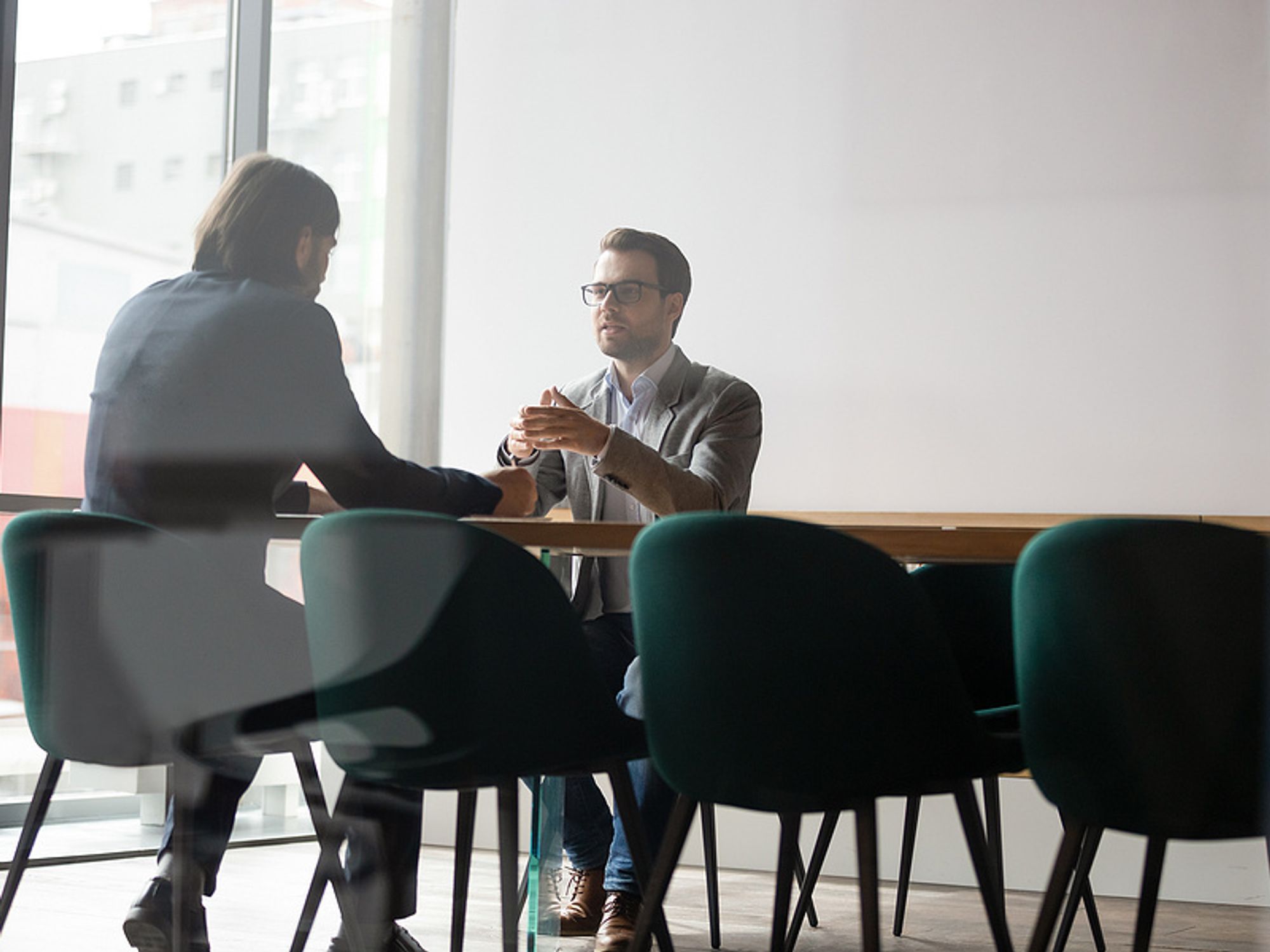 An employee discusses his salary with his supervisor.