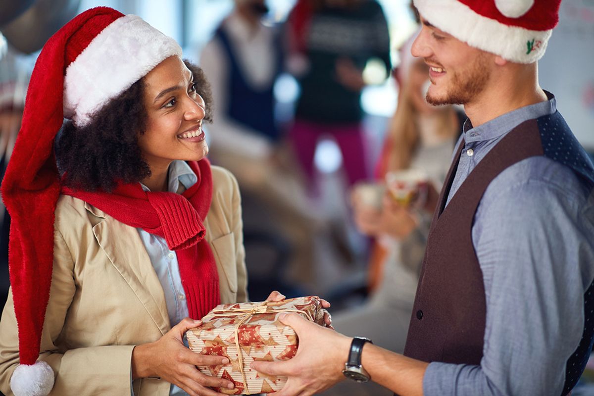 An employee shows appreciation for a co-worker during the holidays