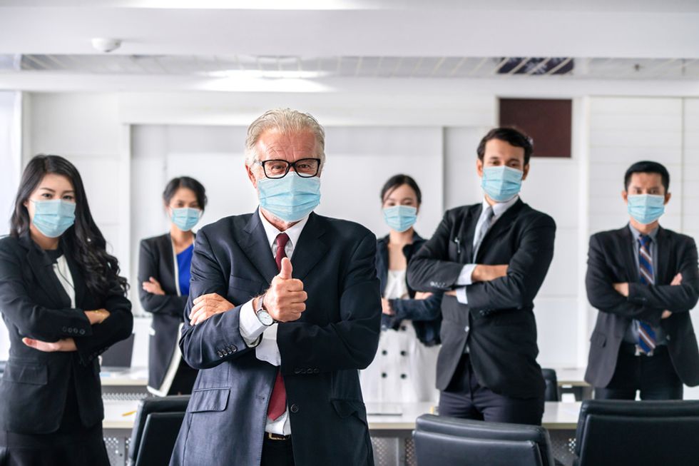 An office wears masks during COVID-19 after going back to work