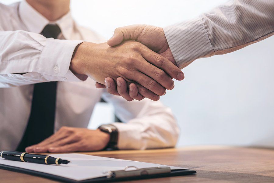 Banker shakes hands with a client