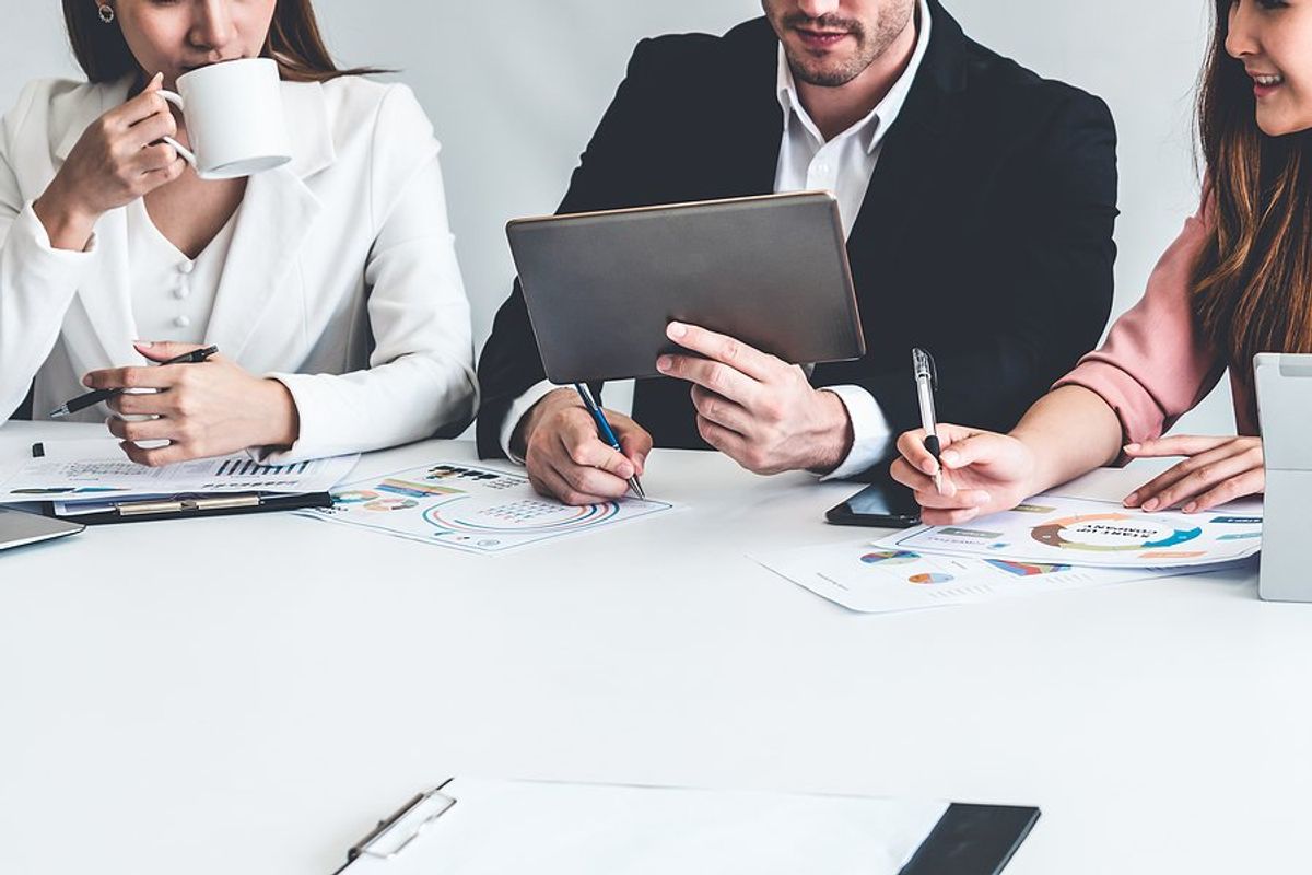 Business leader in a meeting manages change in his organization