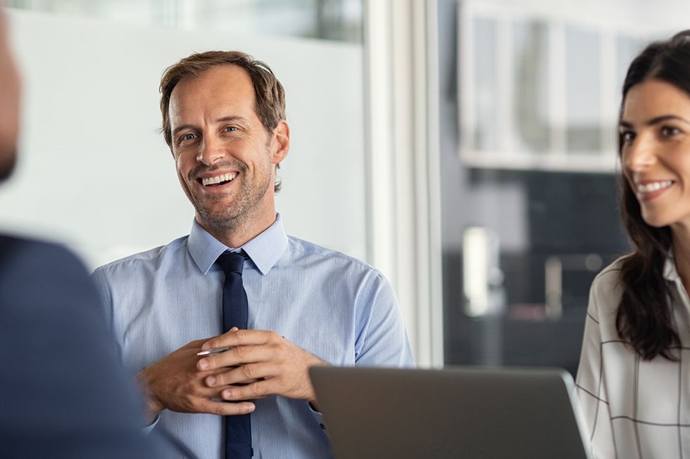 Business partners talk during a meeting