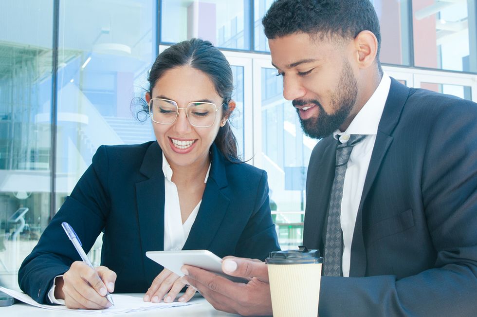Business partners talk during a meeting