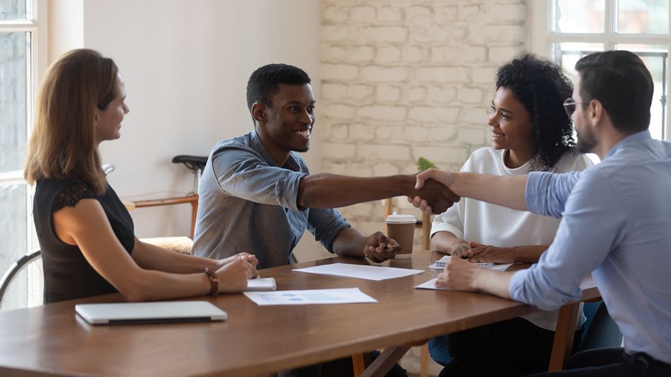 Business people agree to become business partners