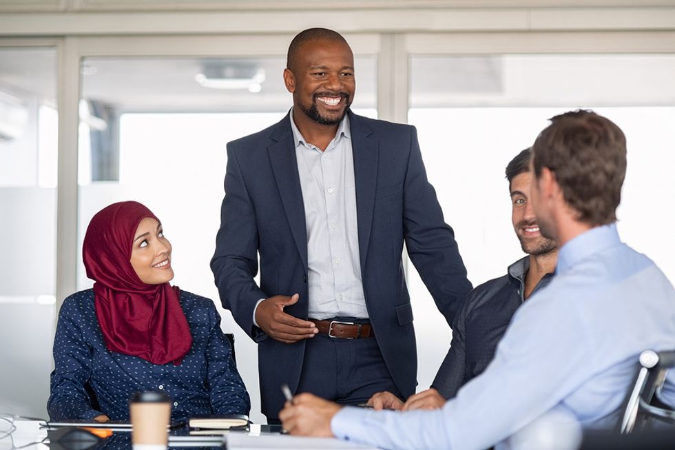 Business people in a meeting discuss key stakeholders