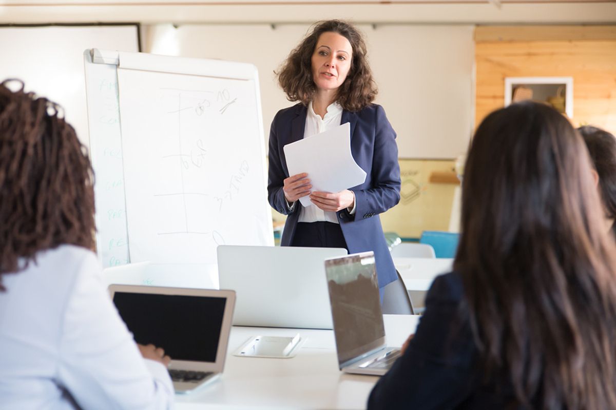 Business woman leads her team through chaos