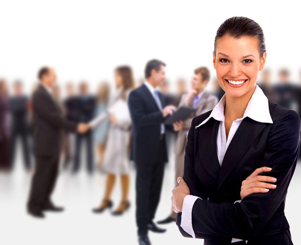 Business woman smiling because she's in a fast-growing and high-paying career.