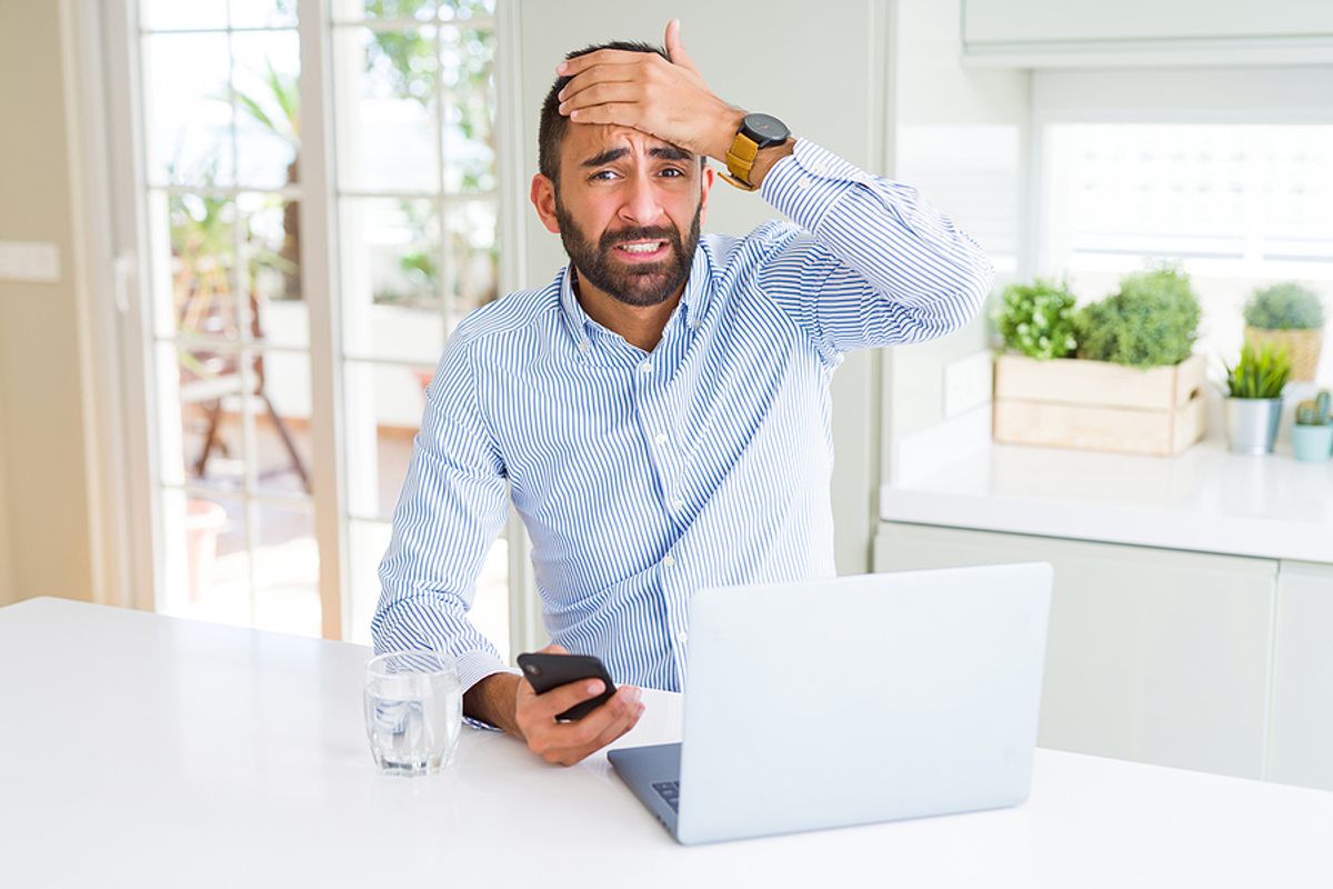 Businessman is stressed out after falling victim to a fake job posting scam