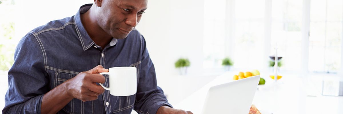 Businessman on laptop actively engages with his network on LinkedIn