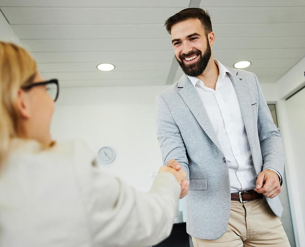 Businessman shakes hands with a key stakeholder