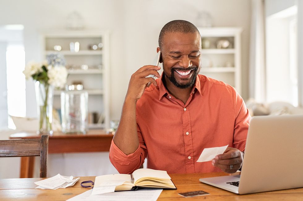 Businessman talks with a colleague on the phone about giving him a LinkedIn endorsement