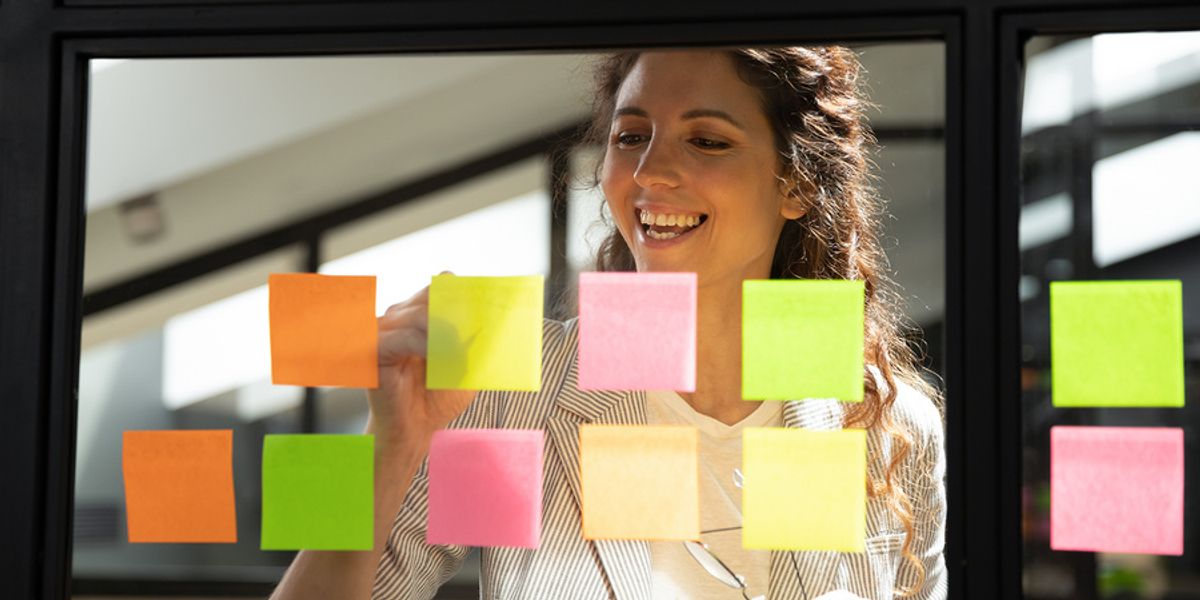 Businesswoman keeps track of daily tasks.