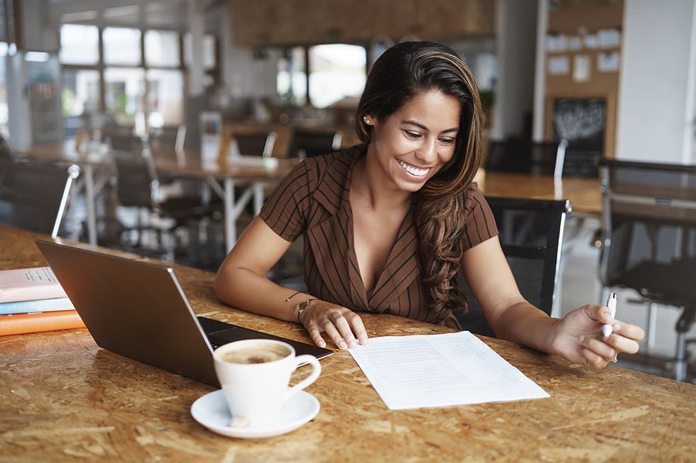 Businesswoman looks over her job search goals for the day