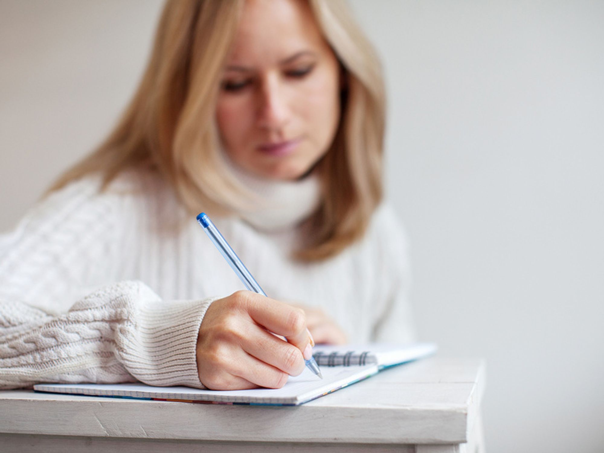Businesswoman makes a list of career resolutions for the year ahead.