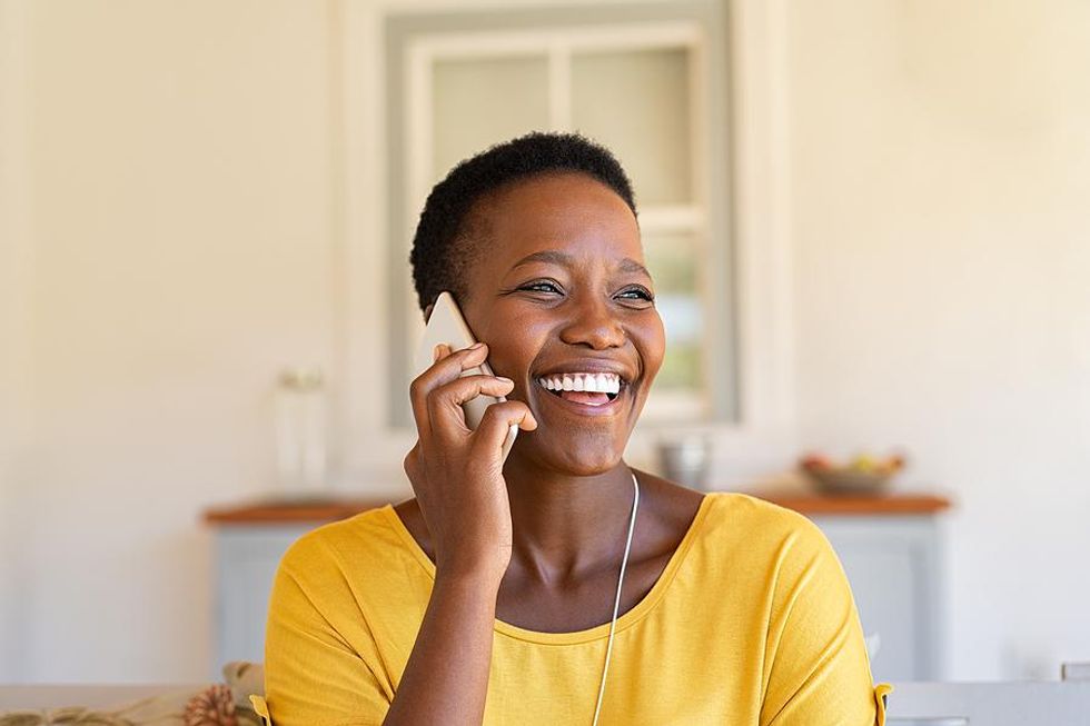 Businesswoman speaks with a professional acquaintance while researching a company's culture.