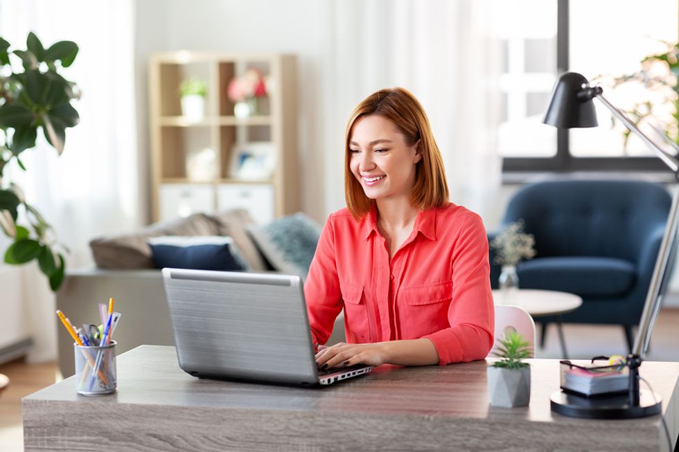 Businesswoman spends some time interacting with LinkedIn connections.