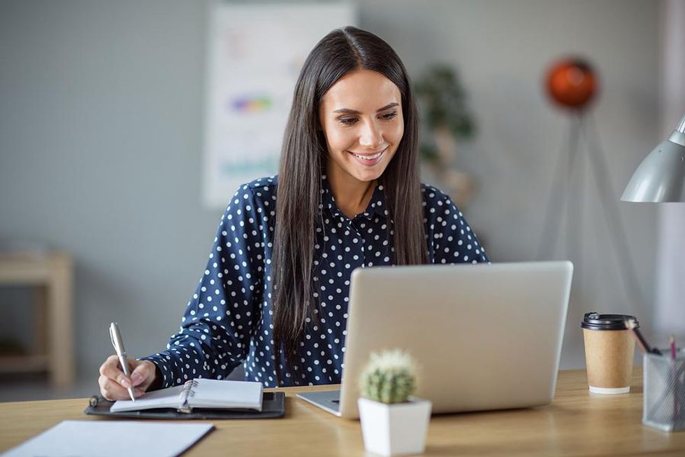 Businesswoman works to customize her resume