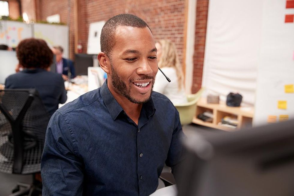 Call center employee talks to a customer on the phone