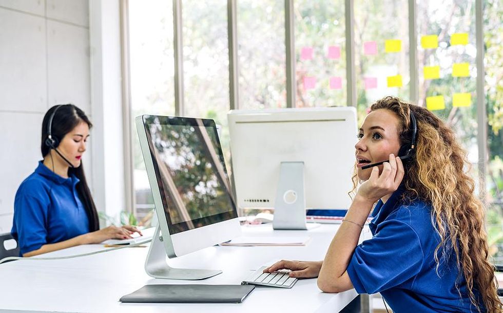 Call center employees help customers over the phone