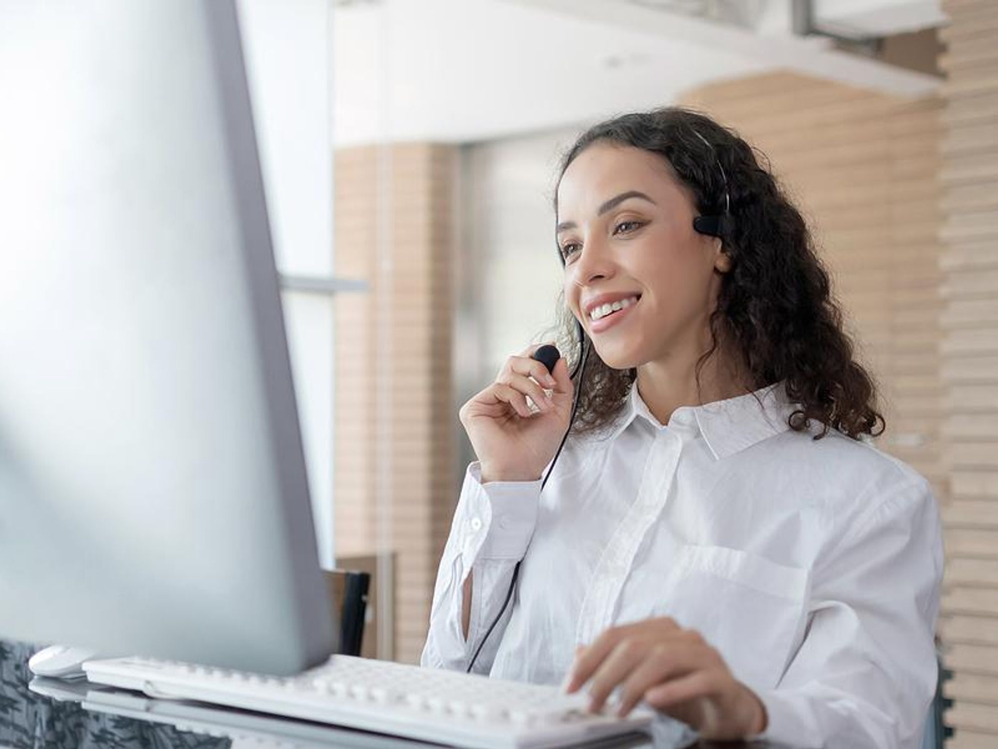 Call / contact center employee talks to a customer