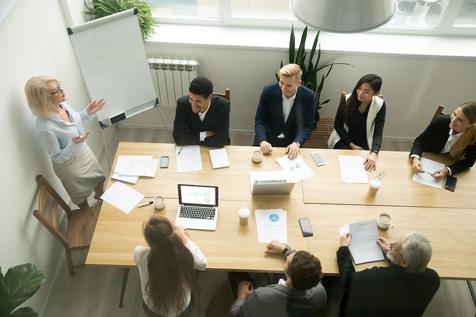 CEO/businesswoman leads a meeting at work