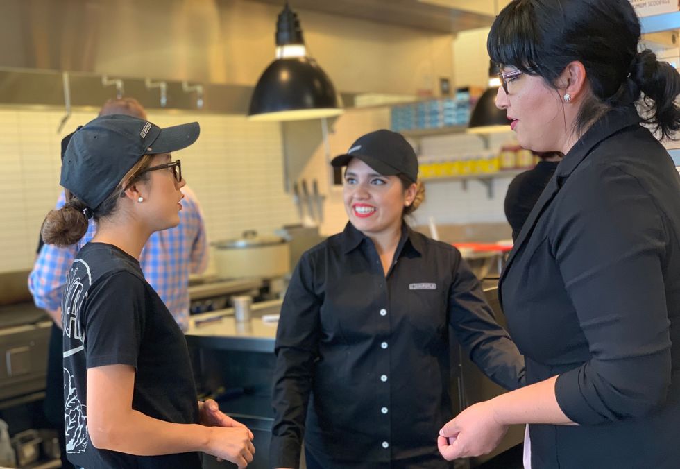 Chipotle employees chat during their shift