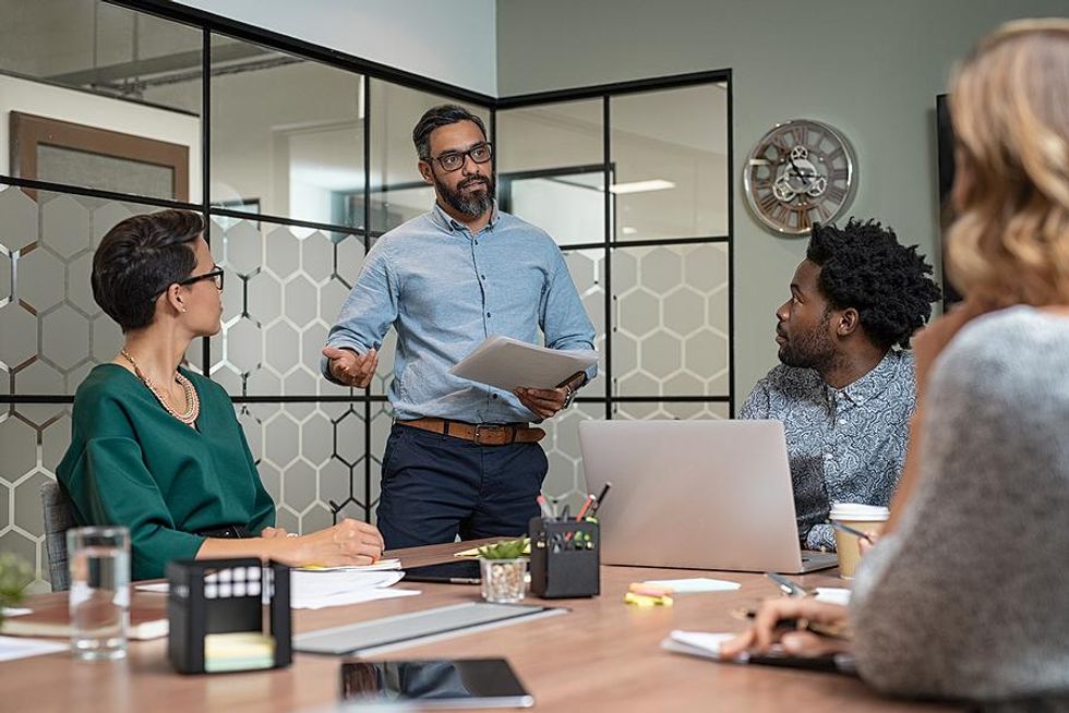 CMO talks to his marketing team during a meeting