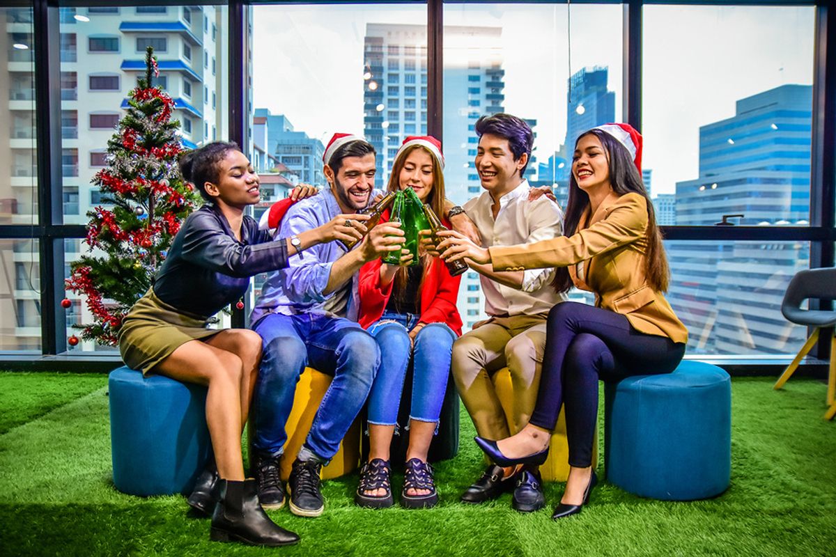 Co-workers celebrate the end of the year with an office holiday party