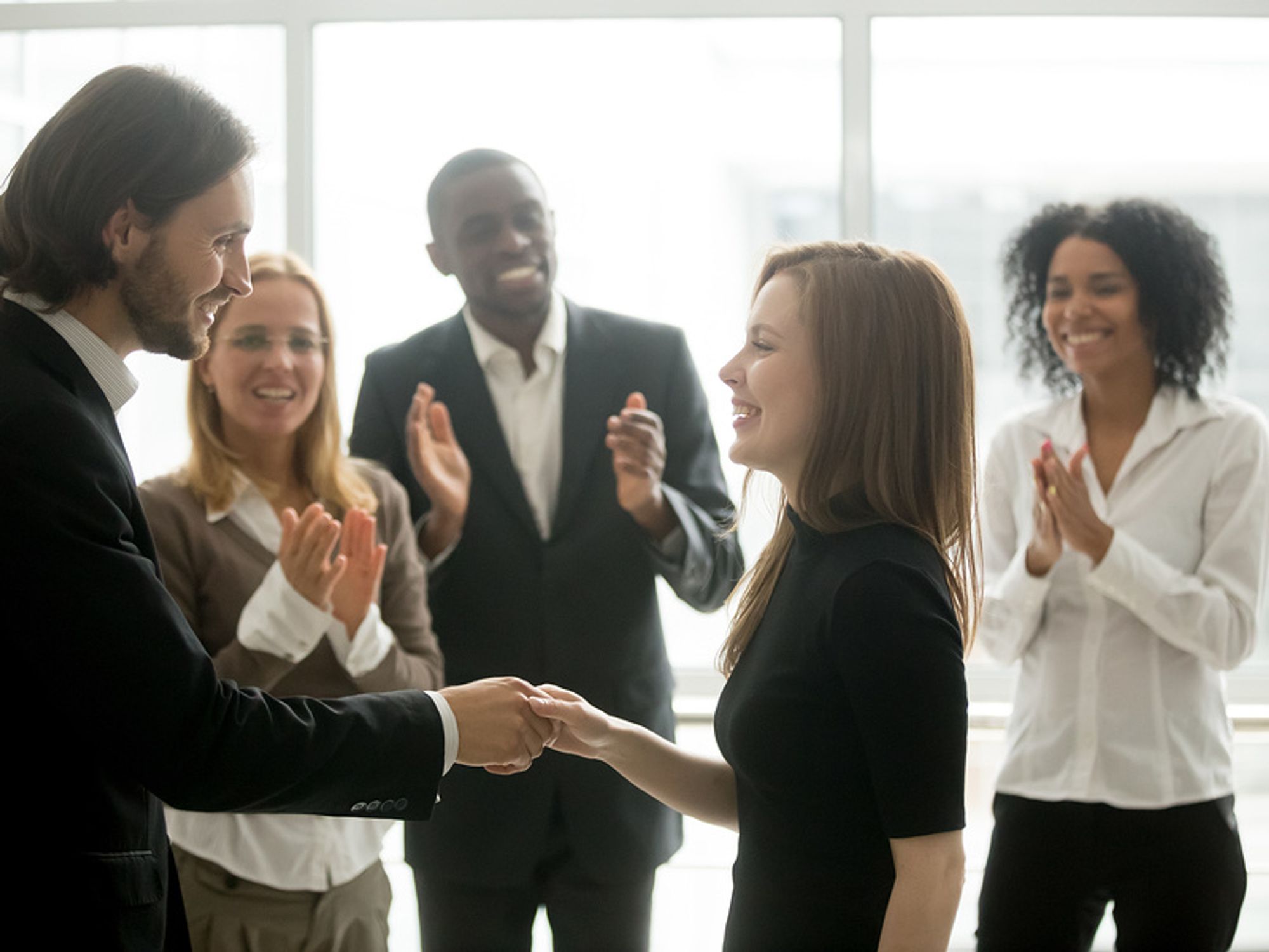 Company CEO recognizes employee for her efforts.